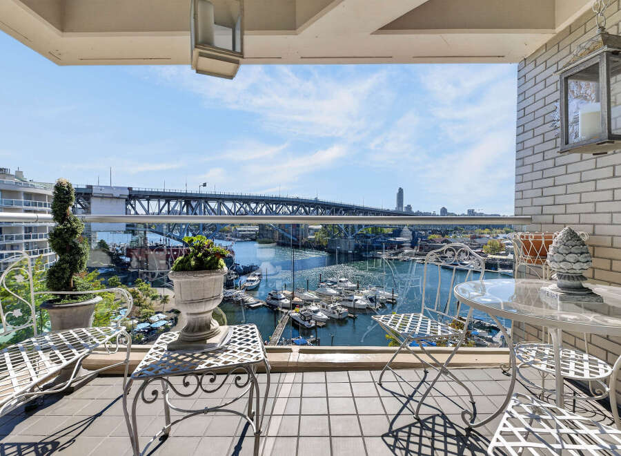 Enjoy breathtaking waterfront views from this stunning balcony, perfect for relaxing or entertaining.