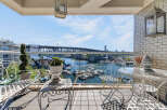Enjoy breathtaking waterfront views from this stunning balcony, perfect for relaxing or entertaining.