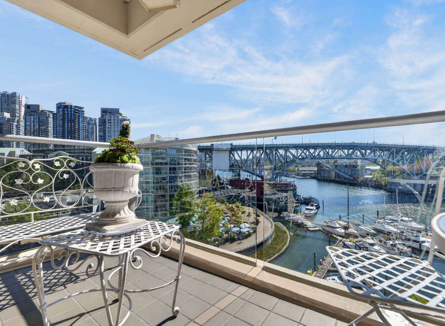 Experience breathtaking waterfront living from this stunning balcony, offering panoramic views of the marina and city skyline.
