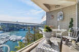 Enjoy breathtaking waterfront views from this stunning balcony, perfect for relaxing or entertaining.