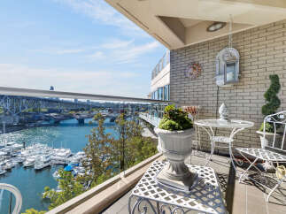 Enjoy breathtaking waterfront views from this stunning balcony, perfect for relaxing or entertaining.