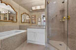 Indulge in luxury with this stunning bathroom featuring a deep soaking tub and a spacious walk-in shower.