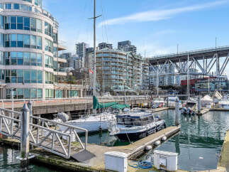 Experience waterfront living at its finest in this stunning property, featuring modern architecture and breathtaking marina views.