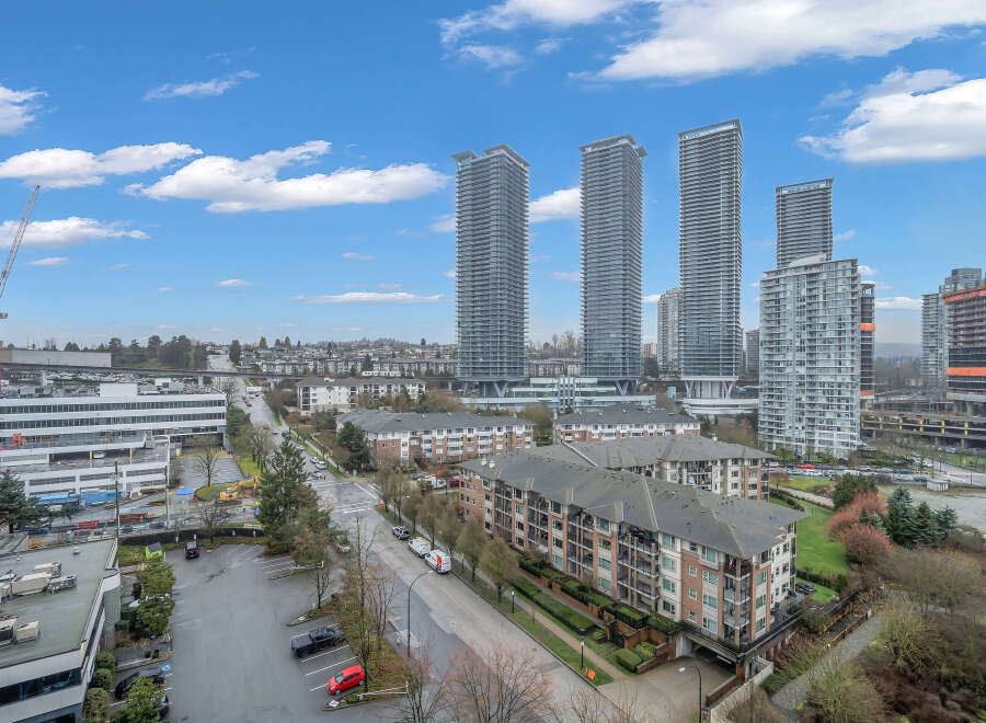 Experience modern urban living in this vibrant cityscape featuring sleek high-rise apartments and well-maintained residential buildings.