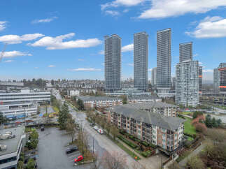 Experience modern urban living in this vibrant cityscape featuring sleek high-rise apartments and well-maintained residential buildings.