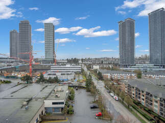 Experience modern urban living in this vibrant cityscape featuring sleek high-rise towers and contemporary apartment buildings.