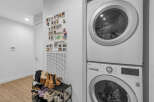Discover modern convenience with this stacked LG washer and dryer set, perfect for optimizing space in your laundry area.