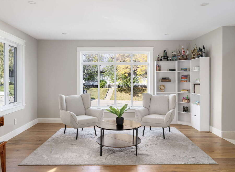 Step into this inviting living space, bathed in natural light from a large picture window overlooking a picturesque yard.