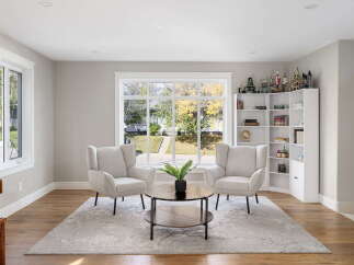 Step into this inviting living space, bathed in natural light from a large picture window overlooking a picturesque yard.
