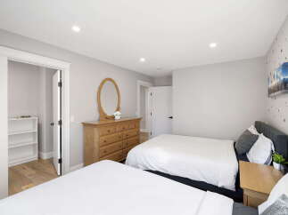 This inviting bedroom features two comfortable beds, perfect for accommodating family or guests.