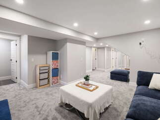 Discover this beautifully finished basement, featuring a spacious living area with plush carpeting and ample storage solutions.