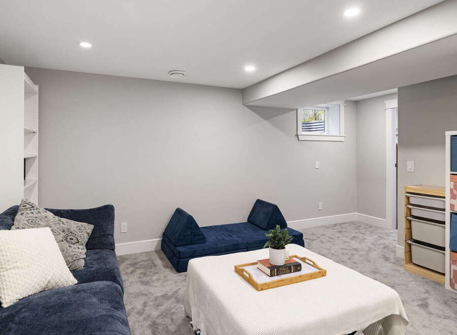 Discover this inviting basement living space, perfect for relaxation and entertainment.