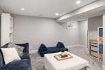 Discover this inviting basement living space, perfect for relaxation and entertainment.