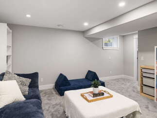 Discover this inviting basement living space, perfect for relaxation and entertainment.