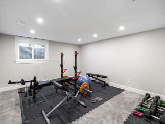 Transform your home into a personal fitness sanctuary with this dedicated gym space.