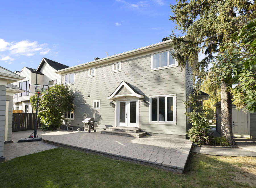 Enjoy outdoor living with this spacious backyard featuring a large paved patio perfect for entertaining.