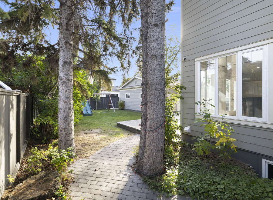 Step into this charming backyard, perfect for outdoor enjoyment and relaxation.