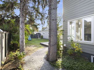 Step into this charming backyard, perfect for outdoor enjoyment and relaxation.