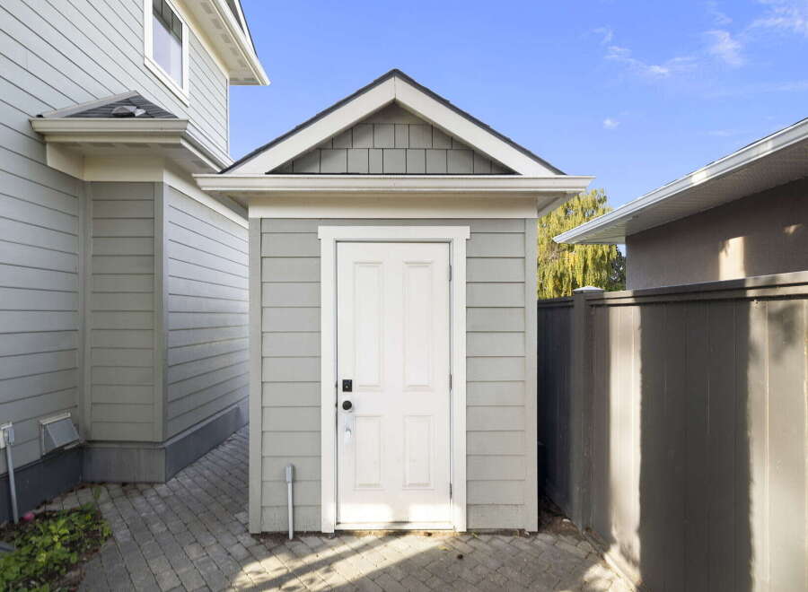 Discover this charming property featuring a detached shed, perfect for extra storage or a workshop space.