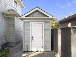 Discover this charming property featuring a detached shed, perfect for extra storage or a workshop space.