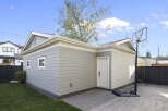 Discover this charming property featuring a detached garage with a classic gable roof and attractive siding.