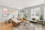 Experience modern living in this spacious open-concept living and dining area, featuring a stylish leather sofa, a comfortable white sectional, and a chic marble-top dining table.