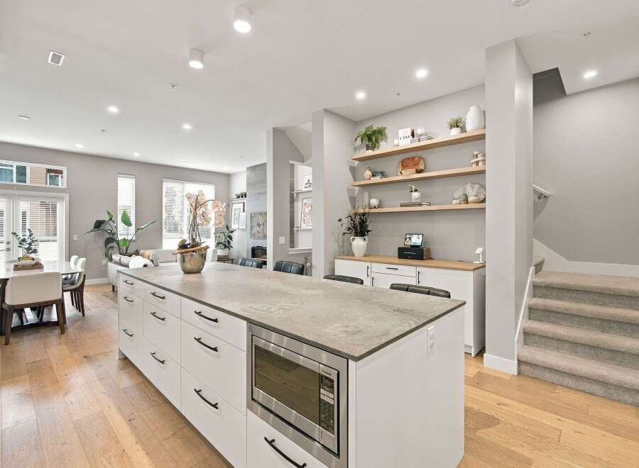 Experience modern living in this stunning open-concept kitchen and dining area.