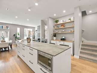Experience modern living in this stunning open-concept kitchen and dining area.
