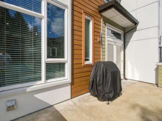 Enjoy outdoor living on this spacious patio, perfect for entertaining or relaxing.
