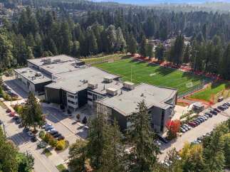 Discover this modern educational facility featuring a state-of-the-art artificial turf sports field, perfect for athletic programs and community events.