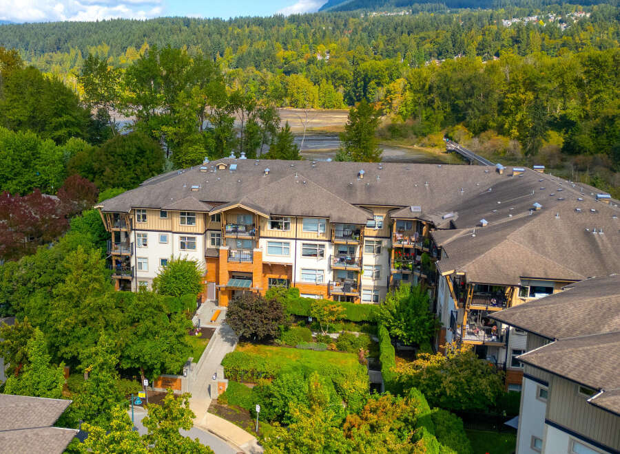 Discover modern living in this stunning apartment complex, nestled amidst lush greenery and offering serene water views.
