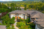Discover modern living in this stunning apartment complex, nestled amidst lush greenery and offering serene water views.