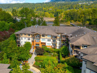 Discover modern living in this stunning apartment complex, nestled amidst lush greenery and offering serene water views.
