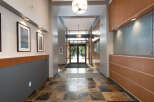 Step into this inviting entryway featuring a striking slate tile floor and elegant framed artwork adorning the walls.