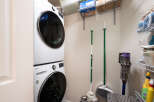 This laundry room features a stacked LG washer and dryer set, perfect for maximizing space in your home.