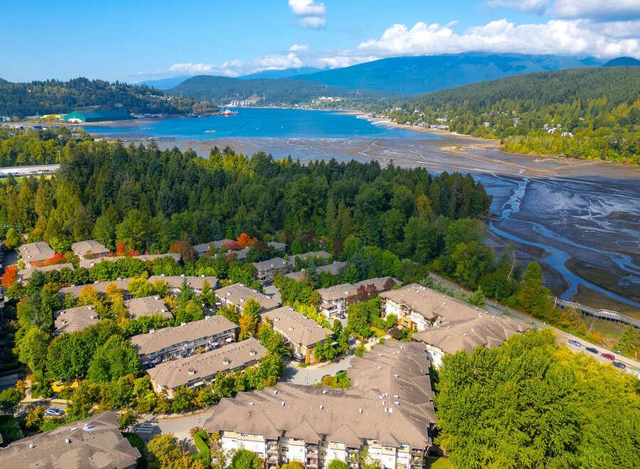 Discover this stunning waterfront community offering modern townhomes with beautiful fall foliage views.