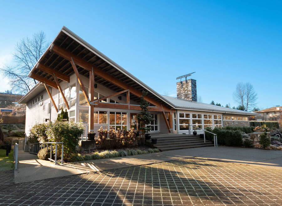 Discover this stunning property featuring a unique architectural design with a prominent pitched roof supported by exposed wooden beams.
