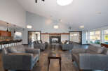 Experience modern comfort in this spacious living area, featuring a cozy fireplace and ample seating.