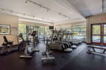 Stay active and healthy in this well-equipped fitness center, featuring a variety of cardio machines like treadmills and stationary bikes.