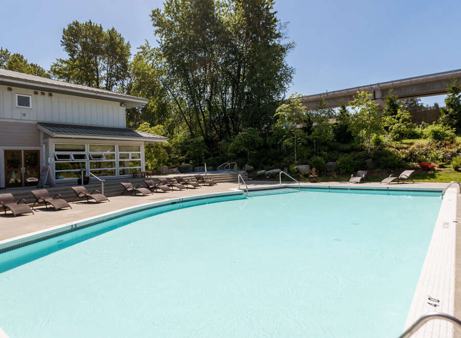 Enjoy a refreshing dip in this stunning outdoor swimming pool, perfect for sunny days.