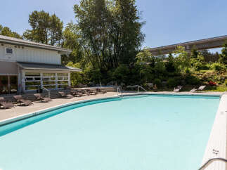 Enjoy a refreshing dip in this stunning outdoor swimming pool, perfect for sunny days.