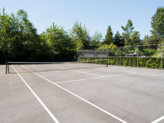 Enjoy outdoor recreation on this pristine tennis court, perfect for residents seeking an active lifestyle.
