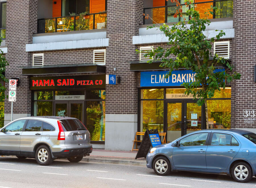 Discover vibrant commercial spaces in a prime urban location, featuring prominent storefronts for 'Mama Said Pizza Co.
