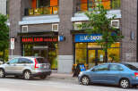 Discover vibrant commercial spaces in a prime urban location, featuring prominent storefronts for 'Mama Said Pizza Co.