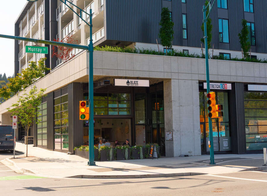 Discover modern urban living at Mosaic Woody Yard, featuring contemporary architecture and vibrant street-level retail spaces.