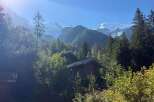Experience the tranquility of mountain living with this charming property nestled amidst lush greenery and breathtaking alpine views.