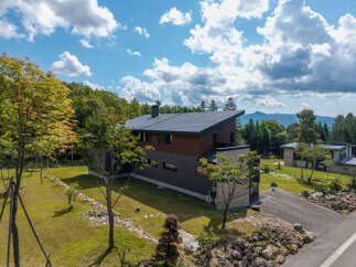 Experience modern living in this stunning architectural home nestled amidst lush greenery and scenic mountain views.