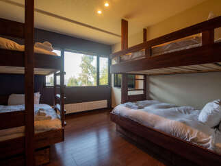 Experience ultimate comfort and convenience in this spacious bunk room, perfect for families or groups.
