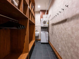 Discover this spacious walk-in closet featuring ample shelving and hanging space, perfect for organizing your wardrobe.