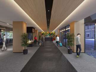 Experience modern comfort in this hotel lobby, featuring a striking geometric art installation and a cozy fireplace.
